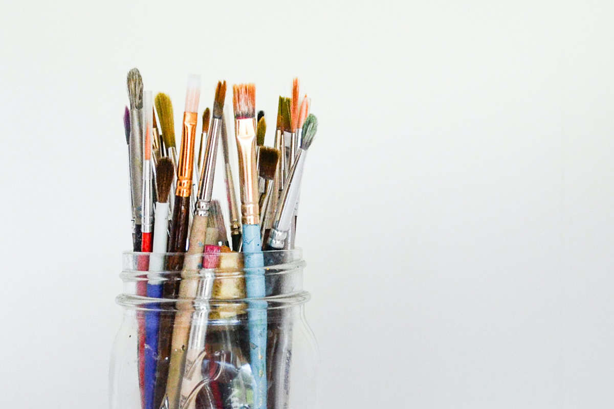 art paint brushes in a glass jar